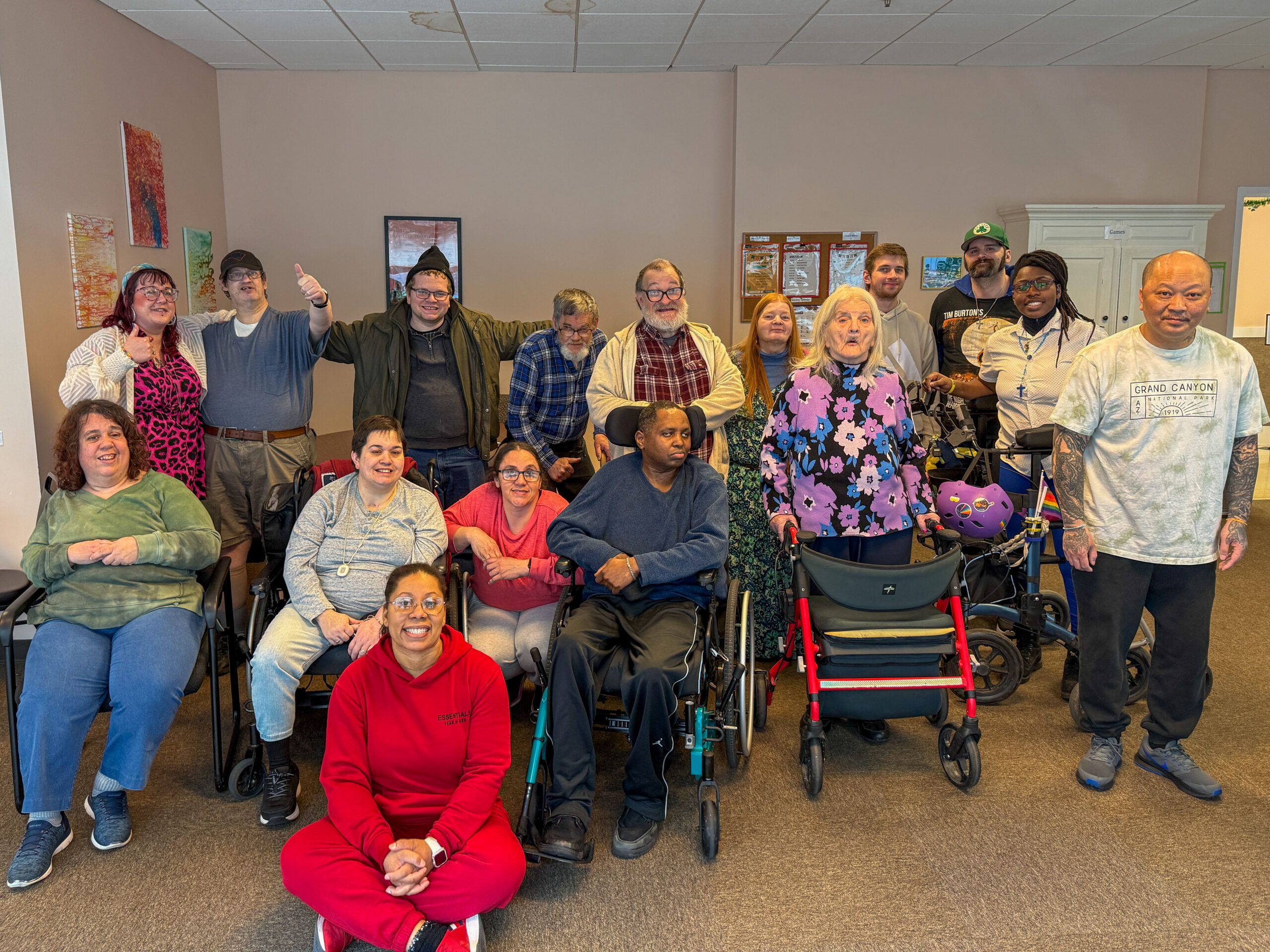 Members of new start smiling and posing for a picture.
